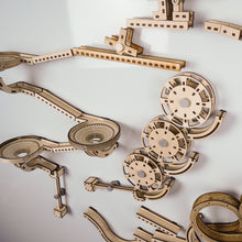 Load image into Gallery viewer, A close-up of the Infinity trax wooden marble run
