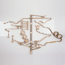 Load image into Gallery viewer, Infinity Trax wooden marble set on a magnetic whiteboard