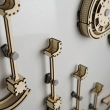 Load image into Gallery viewer, A close up of 'arm' sections of infinity trax wooden marble run