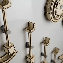 Load image into Gallery viewer, A close up of &#39;arm&#39; sections of infinity trax wooden marble run
